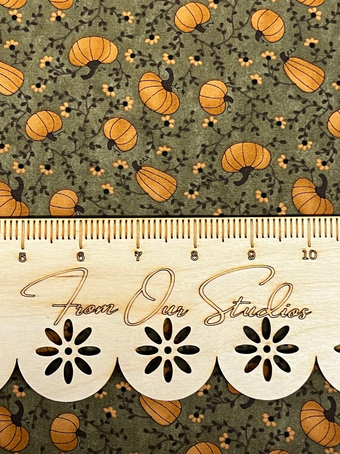 Out-of-print Moda fabric fat quarter with harvest pumpkins on green cotton, perfect for fall quilting, primitive sewing, and crafts