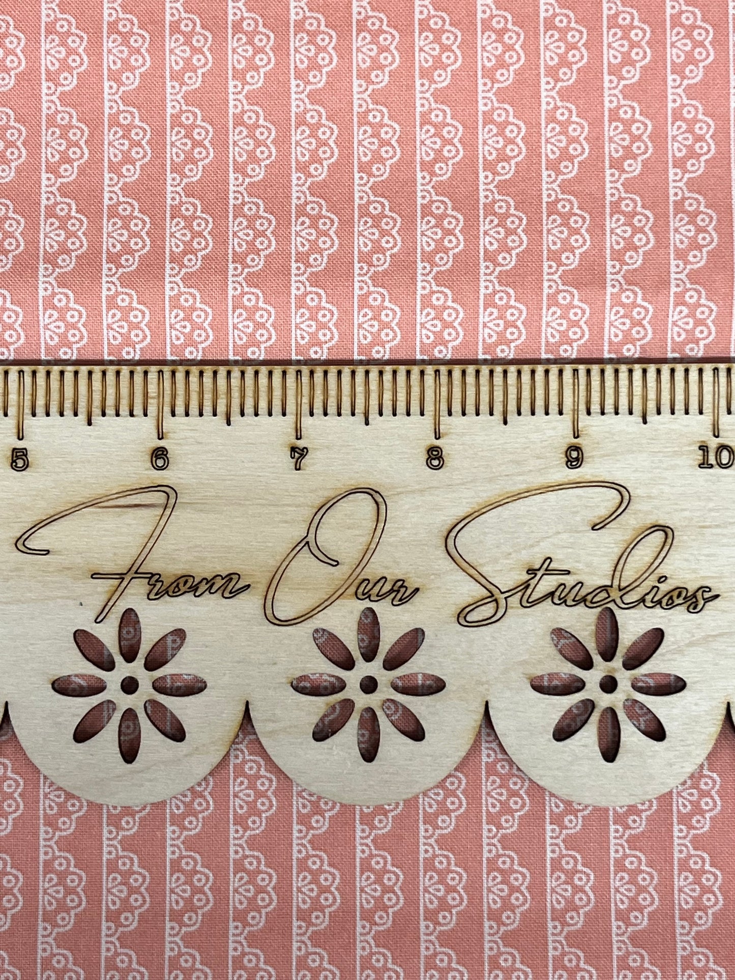 Detailed view of peach lace pattern on Riley Blake Adel in Spring quilting cotton fabric.