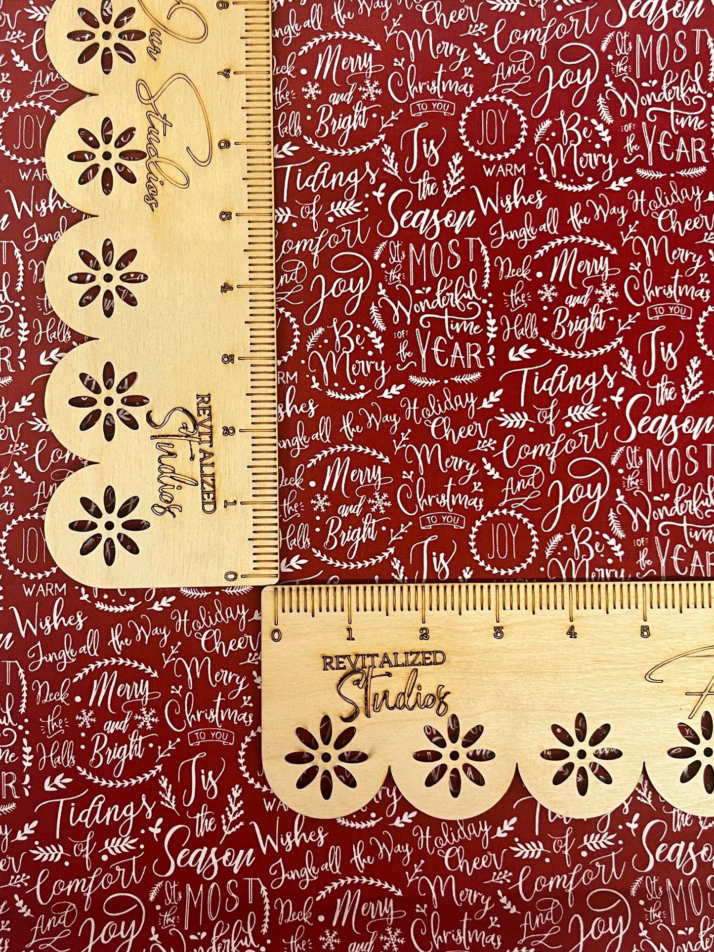 Closeup view of Riley Blake Christmas Traditions red cotton fat quarter with scattered holiday sayings print