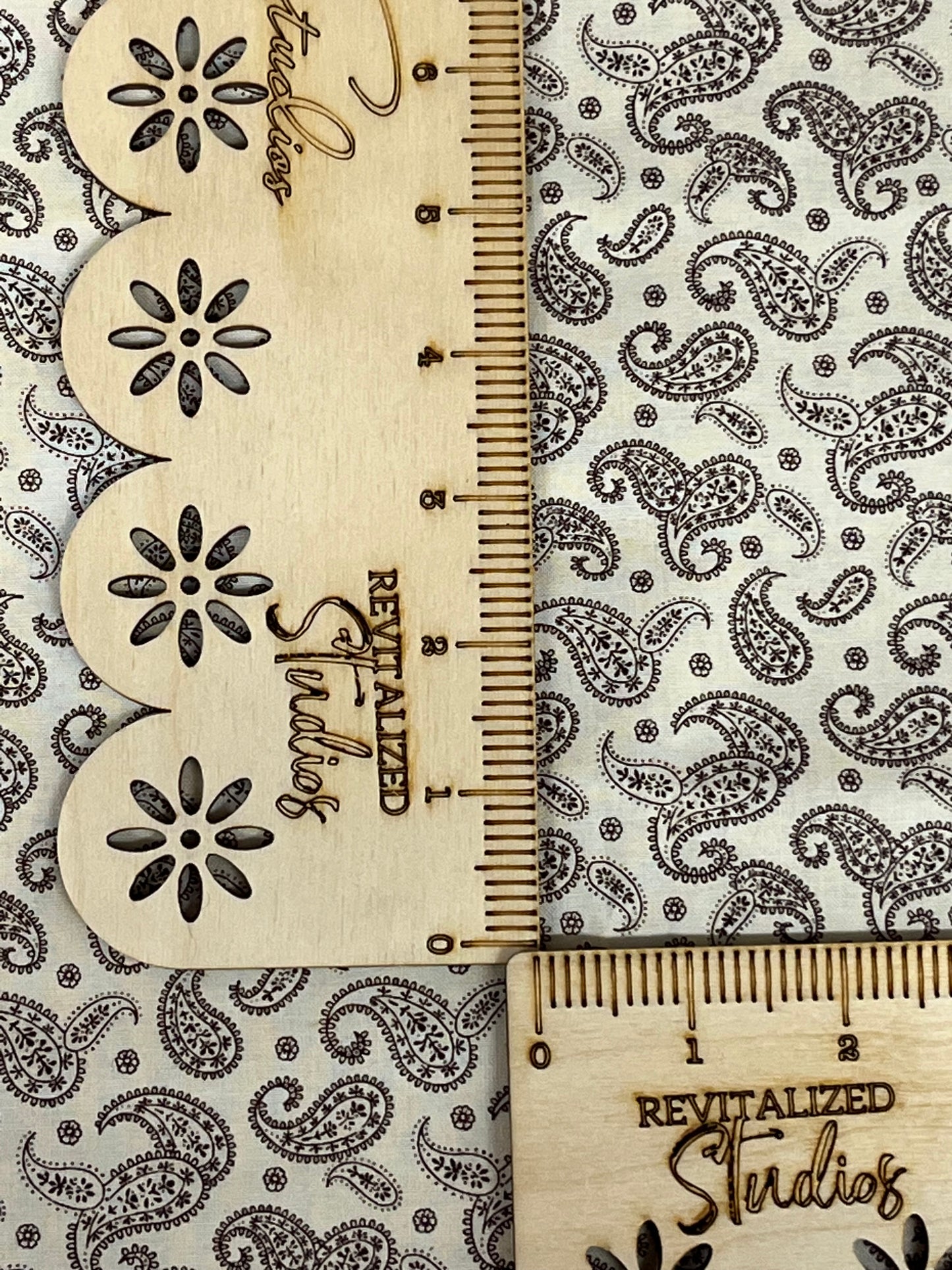Cream background fabric with dark brown paisley design, Marshall Dry Goods fat quarter for quilting, sewing, and journaling.