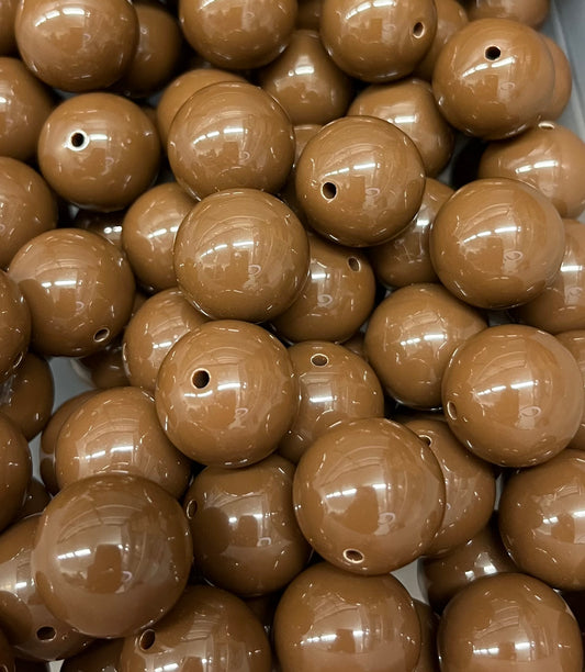 Close-up of glossy 20mm chocolate brown acrylic bubblegum beads for crafting and jewelry making