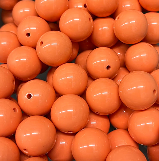 Close-up of glossy 20mm peach bubblegum beads in soft peach color – Revitalized Studios B1017