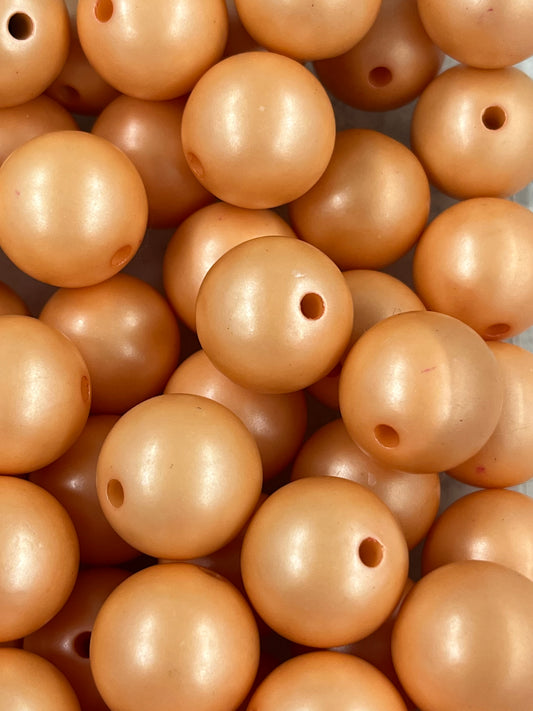 Close-up of 20mm Peach Pearl Bubblegum Beads with soft shimmer finish