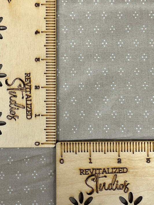 A fabric fat quarter from the Albion Collection by Amy Smart for Riley Blake, featuring a greige color with a small dots