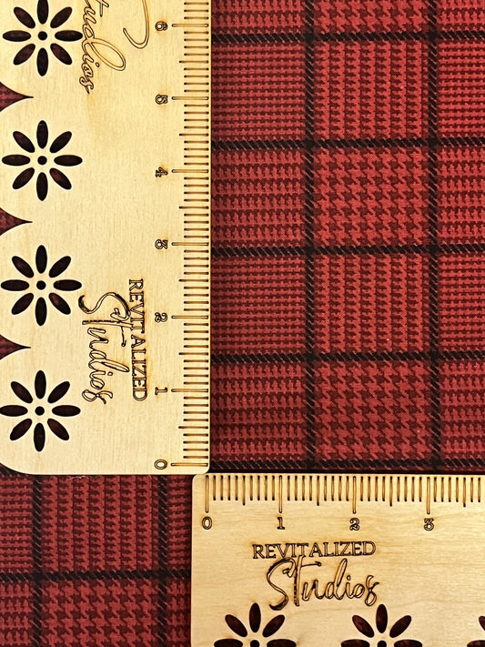 A fat quarter of Riley Blake fabric featuring a vibrant red checkered pattern with decorative floral and revitalized studios branding details.