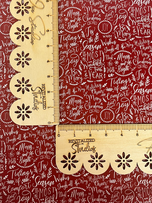 Closeup view of Riley Blake Christmas Traditions red cotton fat quarter with scattered holiday sayings print