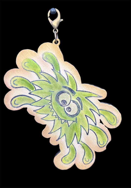 Hand-painted wooden bug charm in bright green with goofy expression, made from birch wood for junk journaling or bag decoration