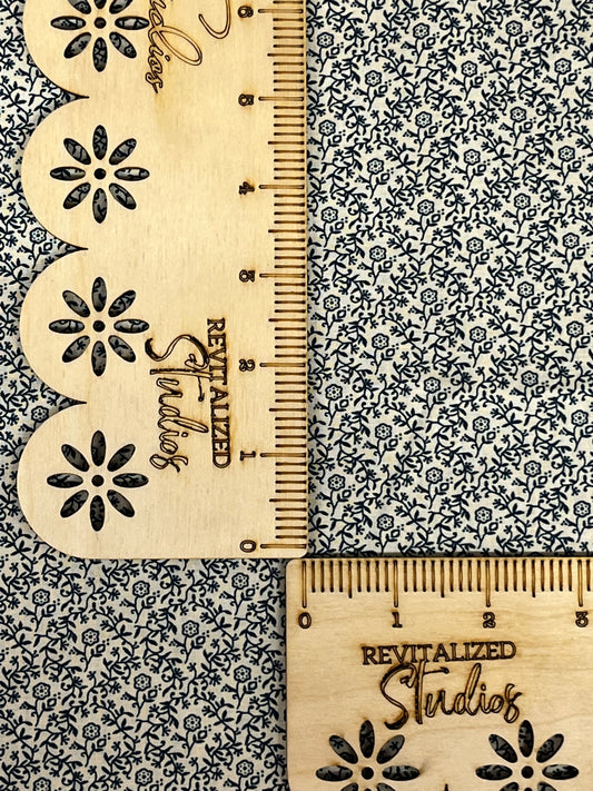 Close-up of cream background fabric with navy floral print, Marshall Dry Goods quilting cotton, sold in fat quarters.