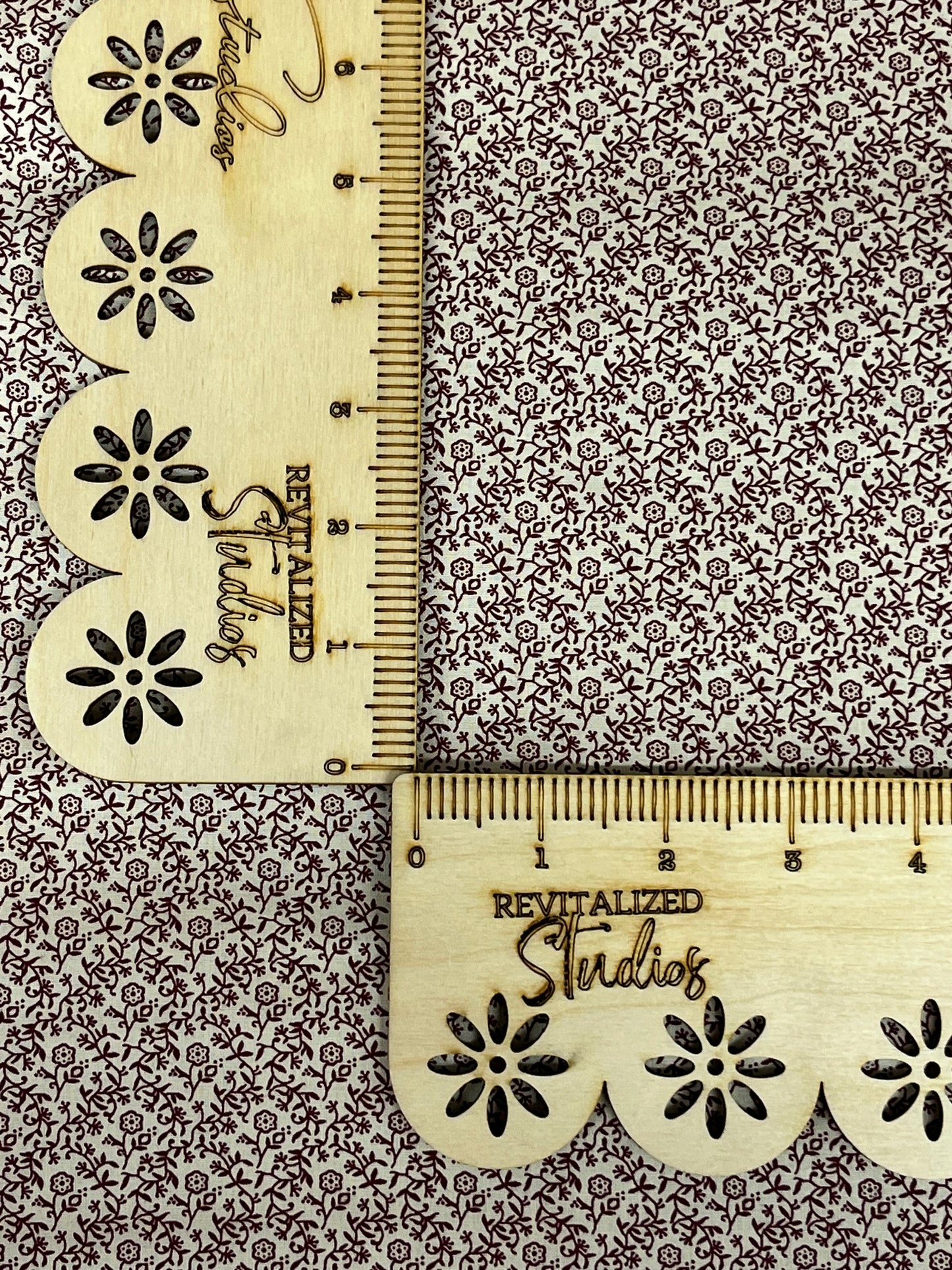 Close-up of Marshall Dry Goods deep mauve floral vine cotton fabric, ideal for quilting, sewing, and journaling crafts.