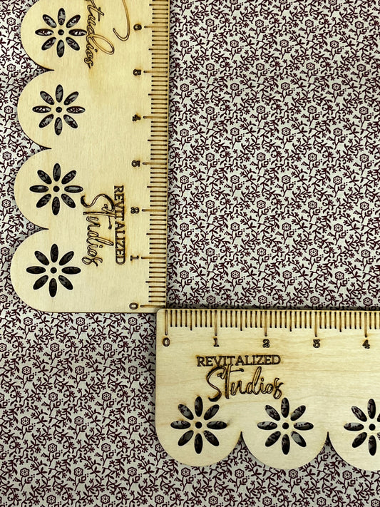 Close-up of Marshall Dry Goods deep mauve floral vine cotton fabric, ideal for quilting, sewing, and journaling crafts.