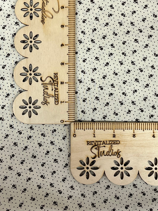 Cream cotton fabric with brown Swiss dots and tiny floral sprigs by Marshall Dry Goods, 22-inch quilting weight reproduction fabric for primitive sewing, patchwork, and journaling.