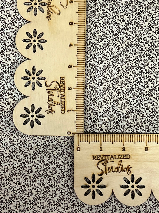Close-up of Marshall Dry Goods 1800’s reproduction fabric, cream background with chocolate brown floral vines. 100% cotton fat quarter quilting fabric.