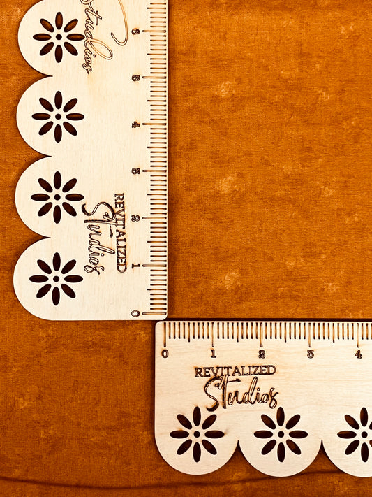 A fat quarter piece of orange tonal fabric with a floral pattern design, labeled as revitalized studio fabric.