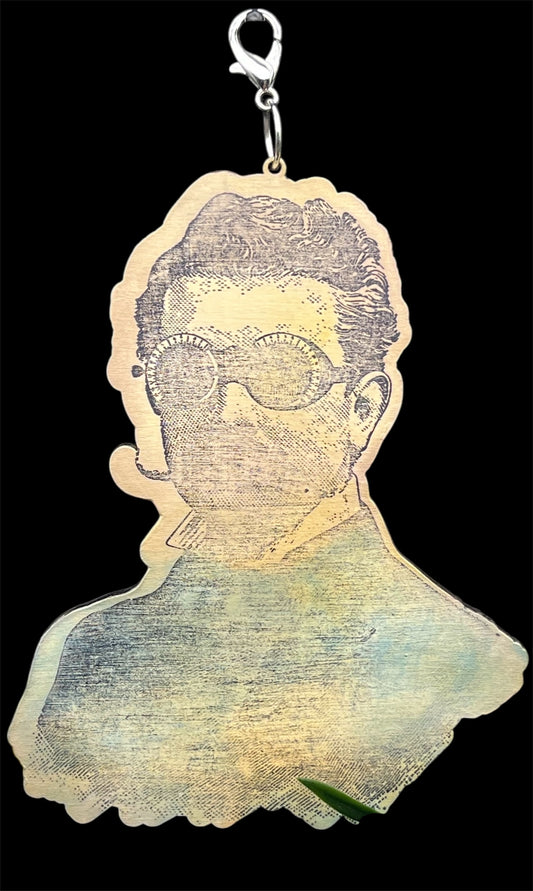 Laser cut birch wood charm featuring a steampunk gentleman with goggles, hand-painted and distressed for junk journal embellishments