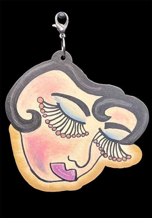 Hand-painted whimsical retro face wood charm with dreamy lashes, made from birch for junk journaling or mixed-media crafts