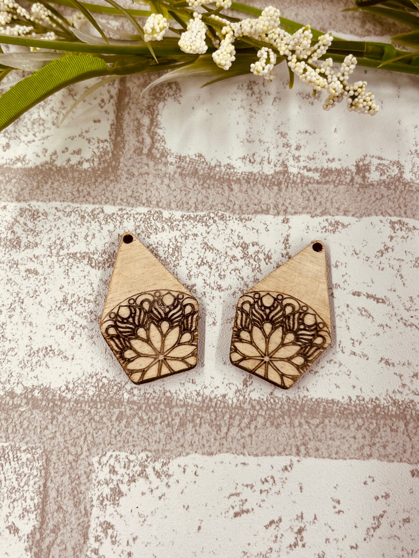 Wood Earring Blanks engraved with a floral Mandala design on bottom. Triangular top